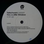 Tiefschwarz-Thru-A-Little-Window-Front